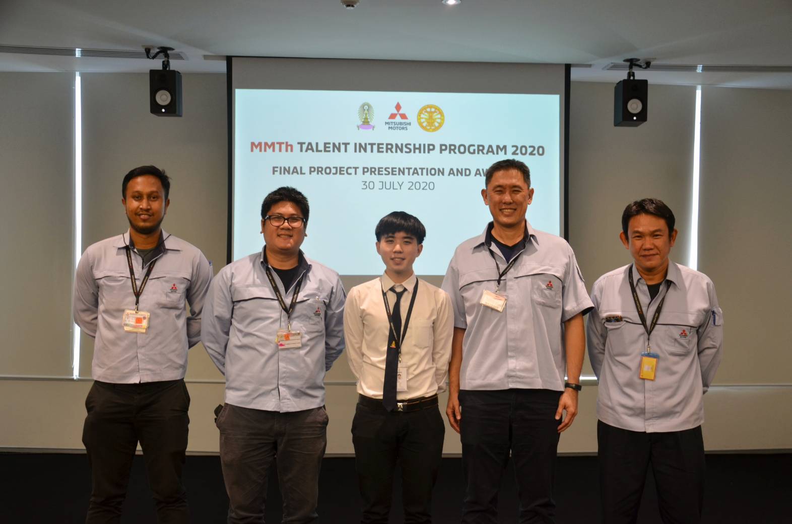 Chatree celebrating the award with the Mitsubishi assembly engineering mentors